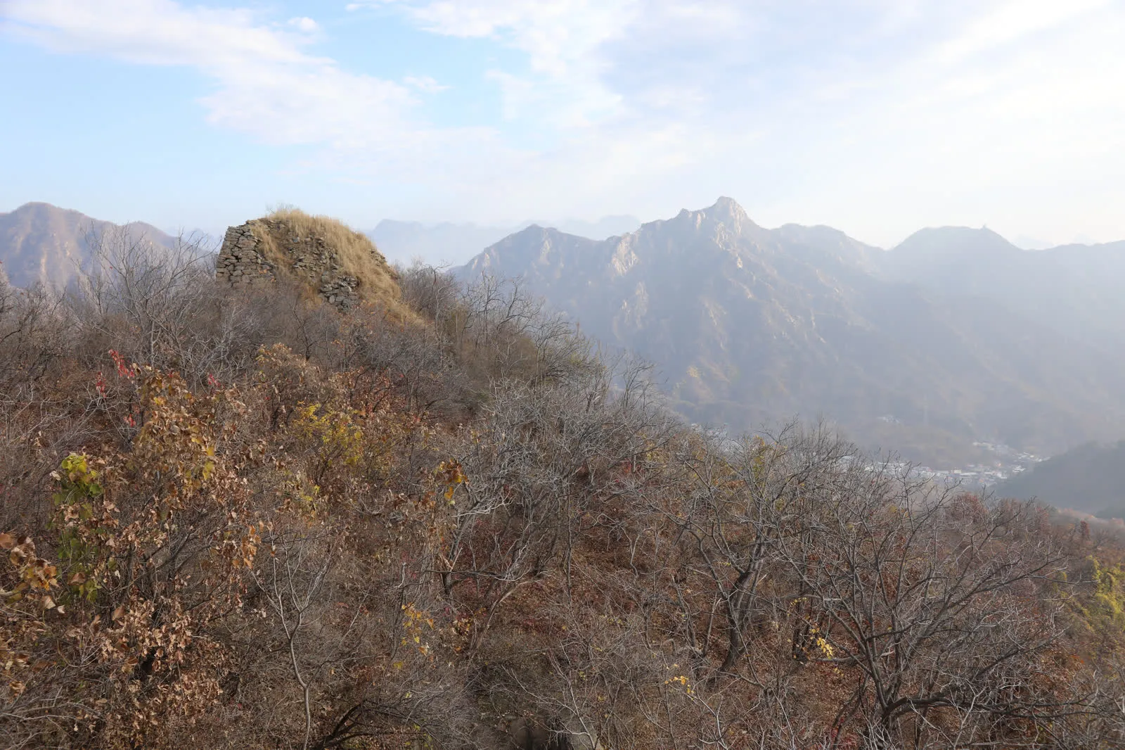 A cable car cabin on the Mutianyu Great Wall cableway above wooded hillside